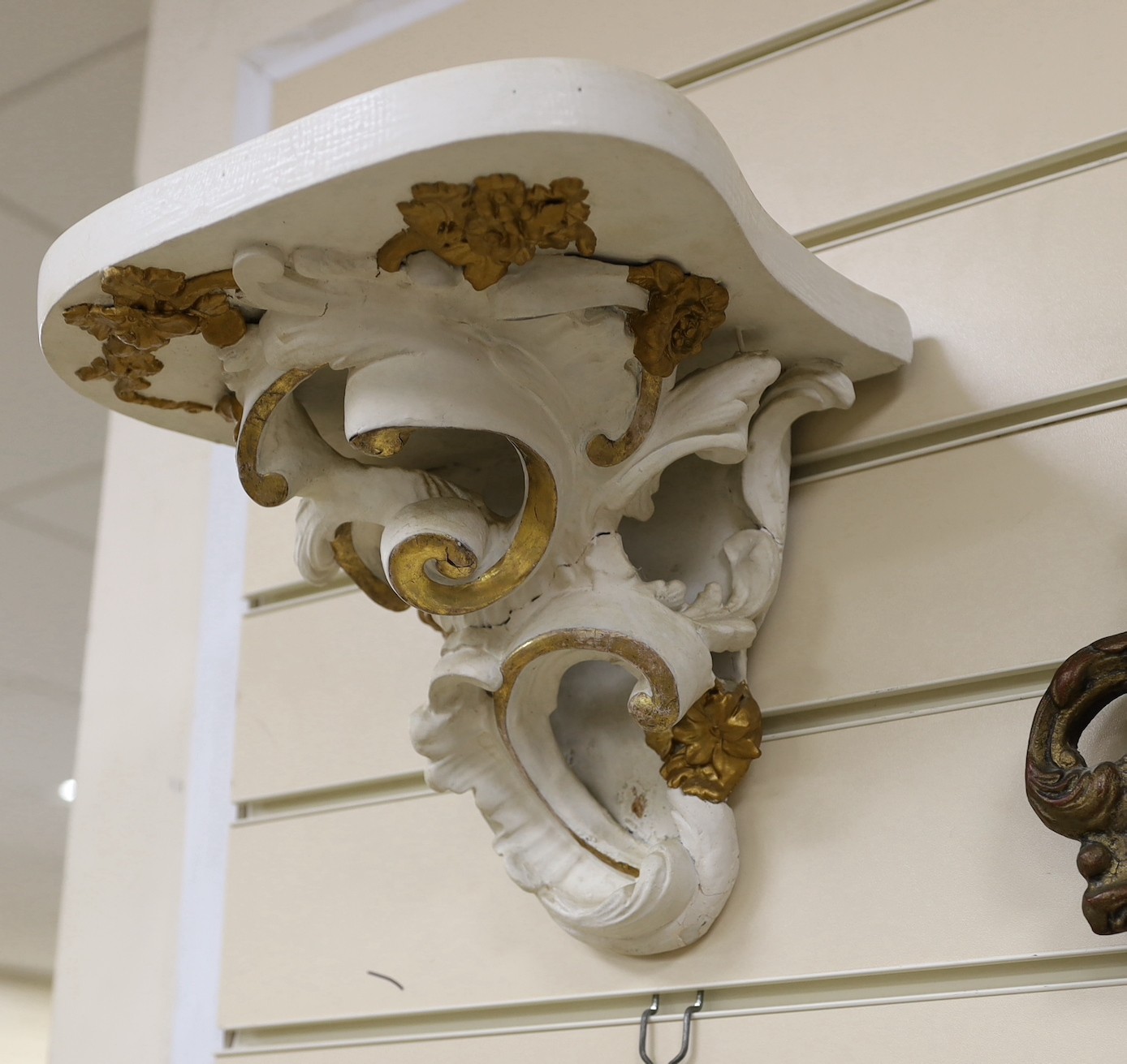 A girandole mirror and two wall brackets